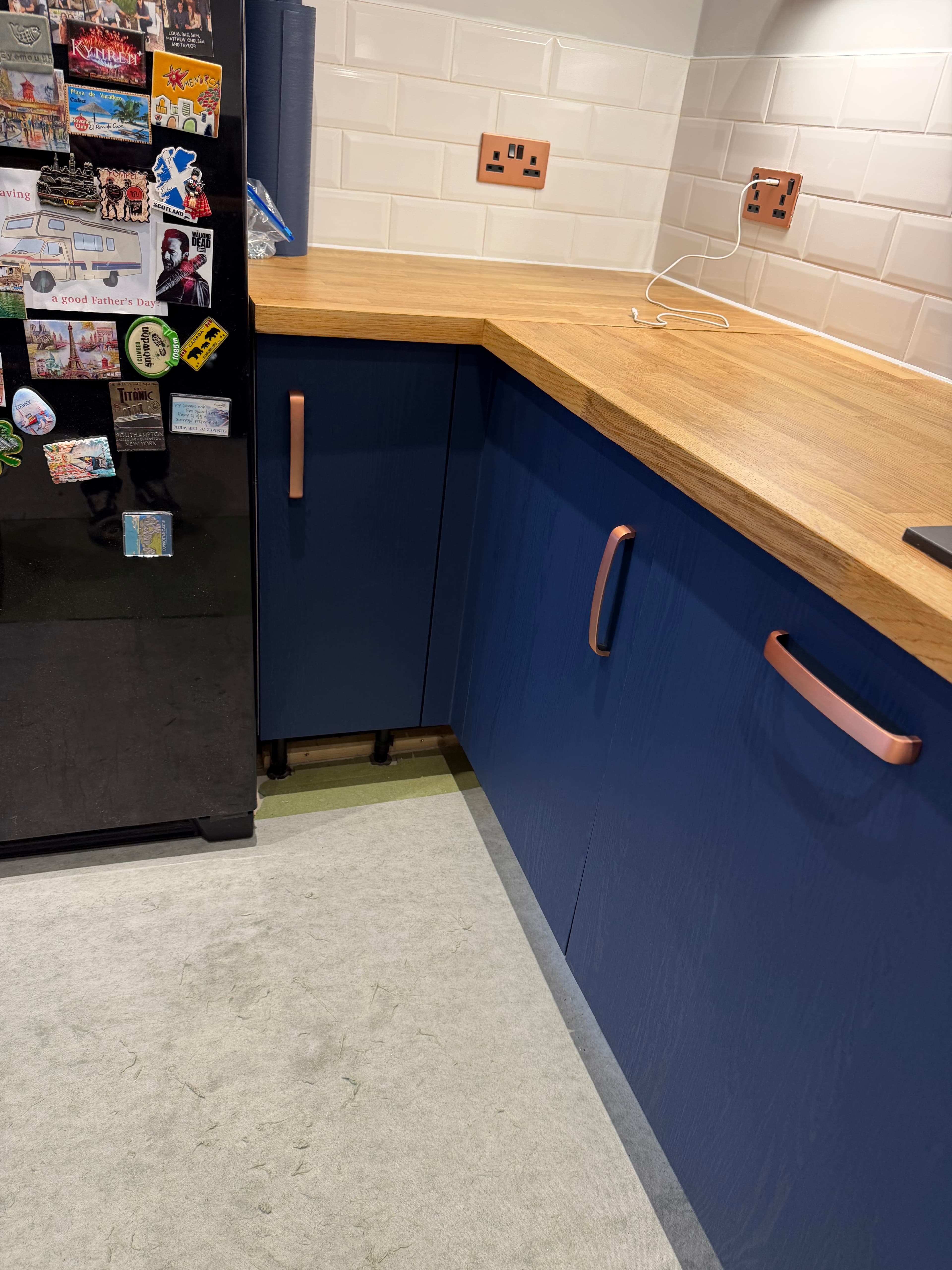 Navy blue kitchen door wrap with wood-effect worktop in Sheffield